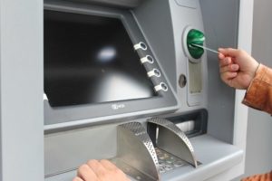 person using ATM